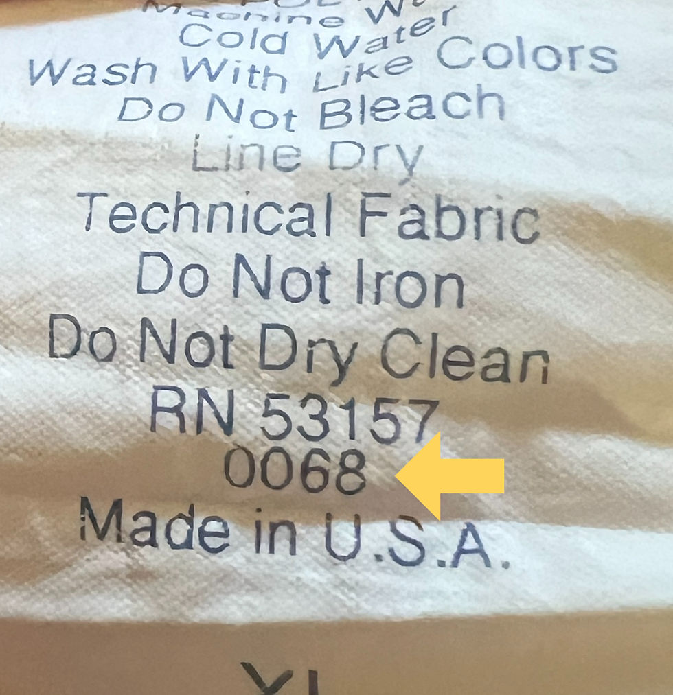 Close-up of a wash tag on a pro-issued baseball jersey, displaying care instructions such as "Do Not Iron" and "Do Not Dry Clean," along with "Made in U.S.A." and 0068 team issued code.
