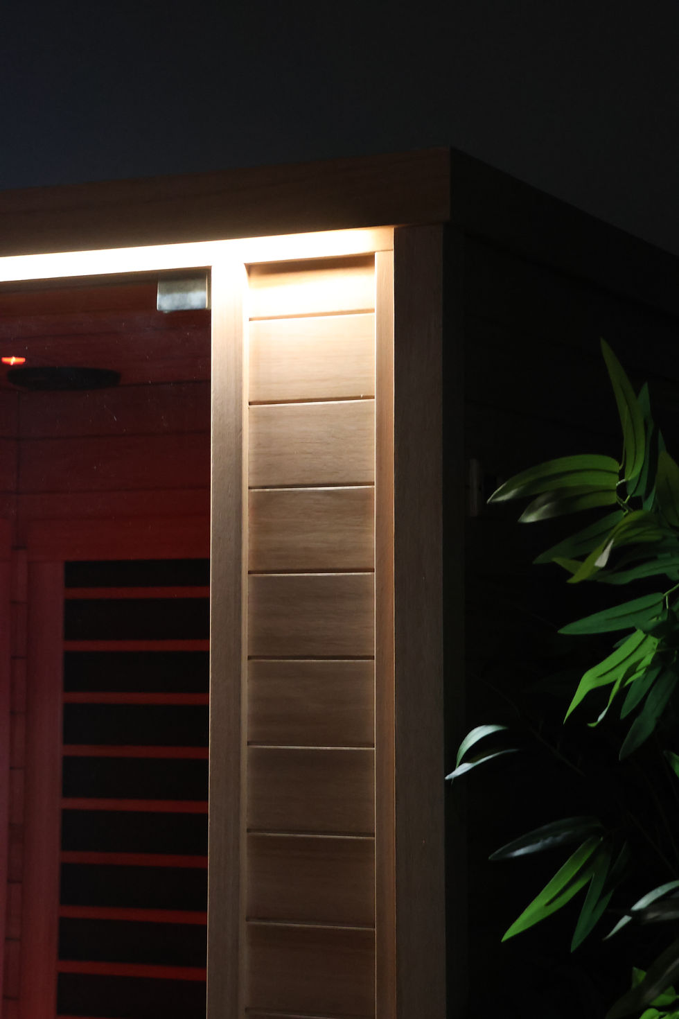 Eye-level view of a modern infrared sauna cabin with wooden interior