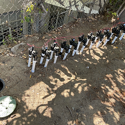 Move valves and replace on back side of a parking lot.