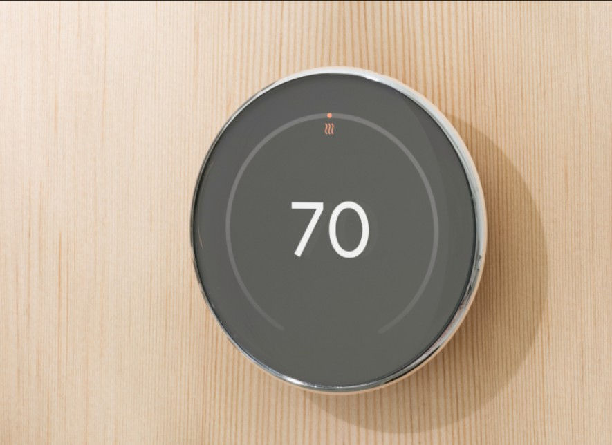 Eye-level view of Google Nest Thermostat 4 displaying temperature settings