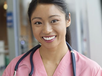 Smiling Nurse in Scrubs