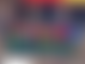 Mr. Chairman Martyn David Crespel TEP, with sponsored children standing against a newly constructed classroom