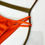 Miniatura: Orange Brazilian Bikini Push-Up Top featuring removable padding and matching Brazilian Bottoms