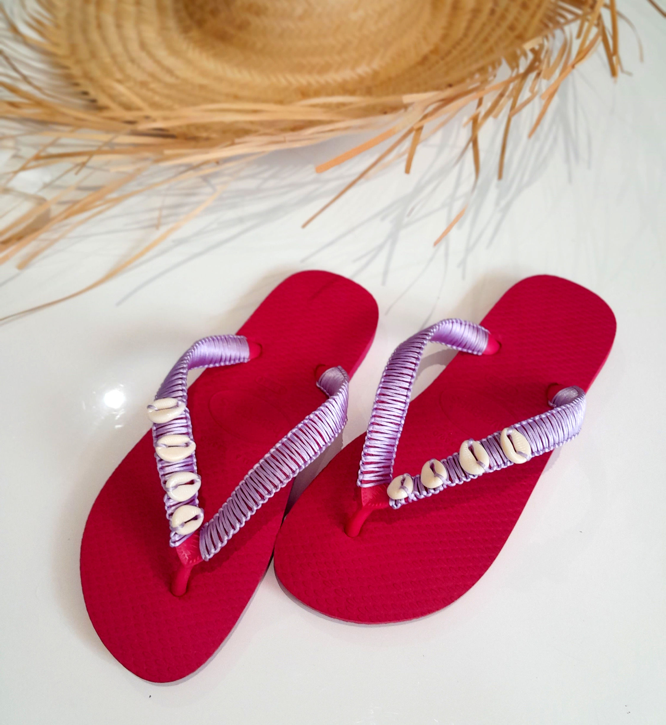 Pink Havaianas Handcrafted in Macrame: Delicate white seashells adorn these coastal-inspired classics.