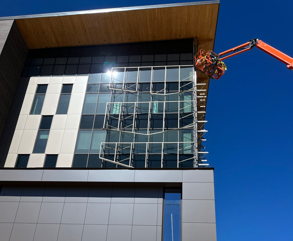 expanded metal panels, powder coated expanded metal panels, weld, ground corners, outrigger system, metal panel system, unitized metal panel system, custom metal panels