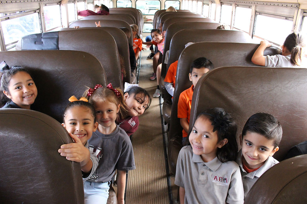 1st graders on the bus on the way to the science center
