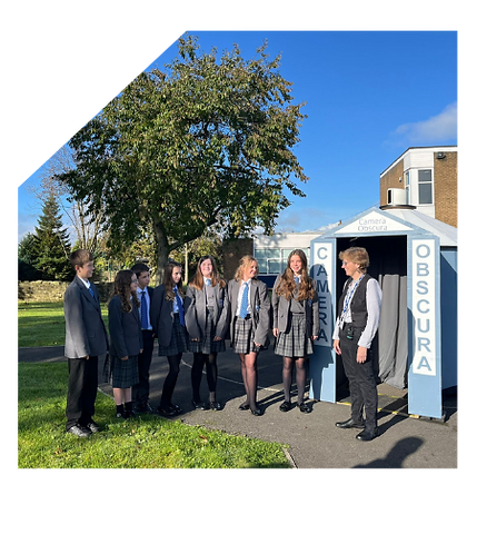 A group of teenage Teesdale School pupils next to the Camera Obscura and the artist