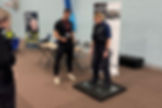 MEMBERS OF WEST MERCIA POLICE, HAVING A GO ON THE VALD FORCE MACHINE