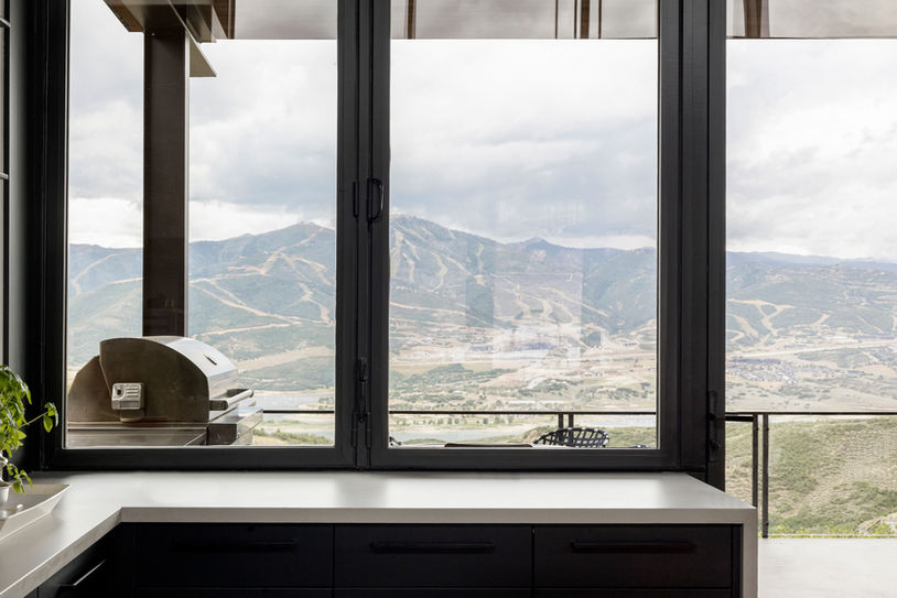 Interior seating area overlooking mountain views from the Axis residence in Tuhaye