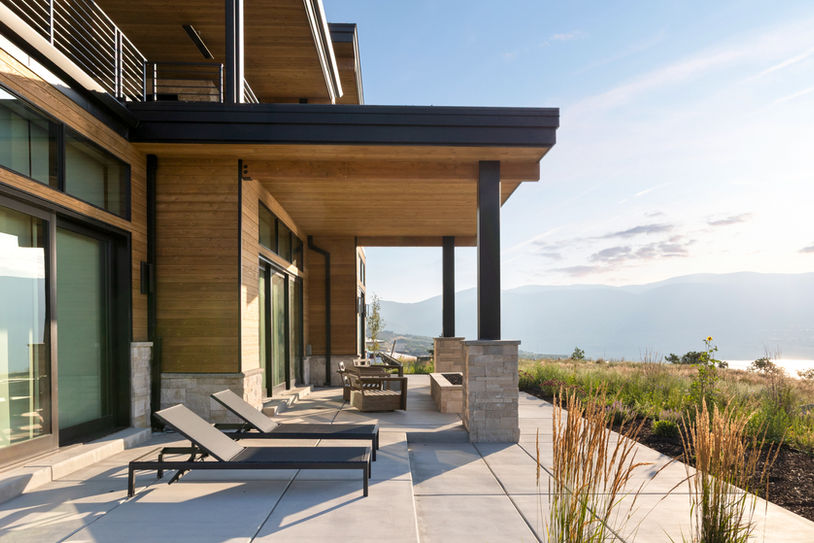 Covered outdoor terrace with lounge seating at the Eagle’s Nest custom home in Deer Valley