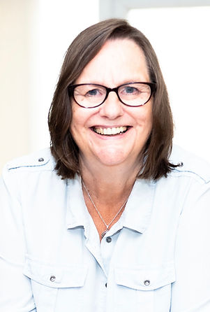 Photo of Jackie Thomson smiling confidently