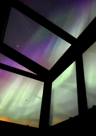 Northern lights from glass cabin in Selfoss, Iceland
