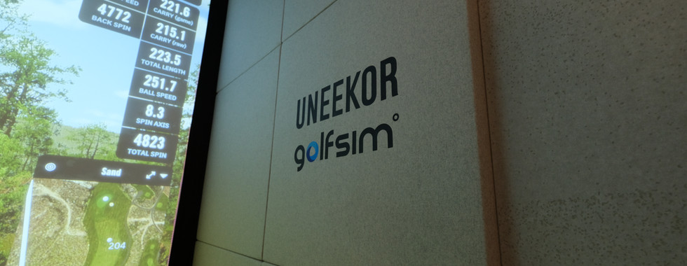 Uneekor golf simulator technology installed by Golfsim Australia, displaying detailed shot data on a widescreen setup