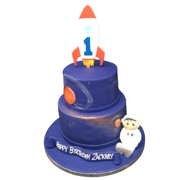 A creative rocket-shaped cake with astronaut figurine on top, perfect for a space-themed celebration.