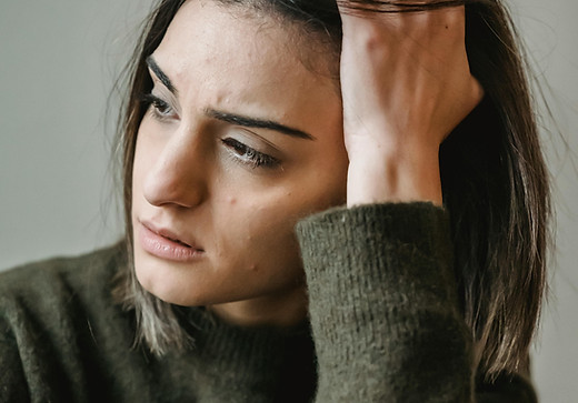 A woman appears worried.