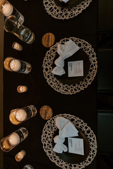 Close up of a black and tan boho table setting at a wedding reception at The Vail wedding venue