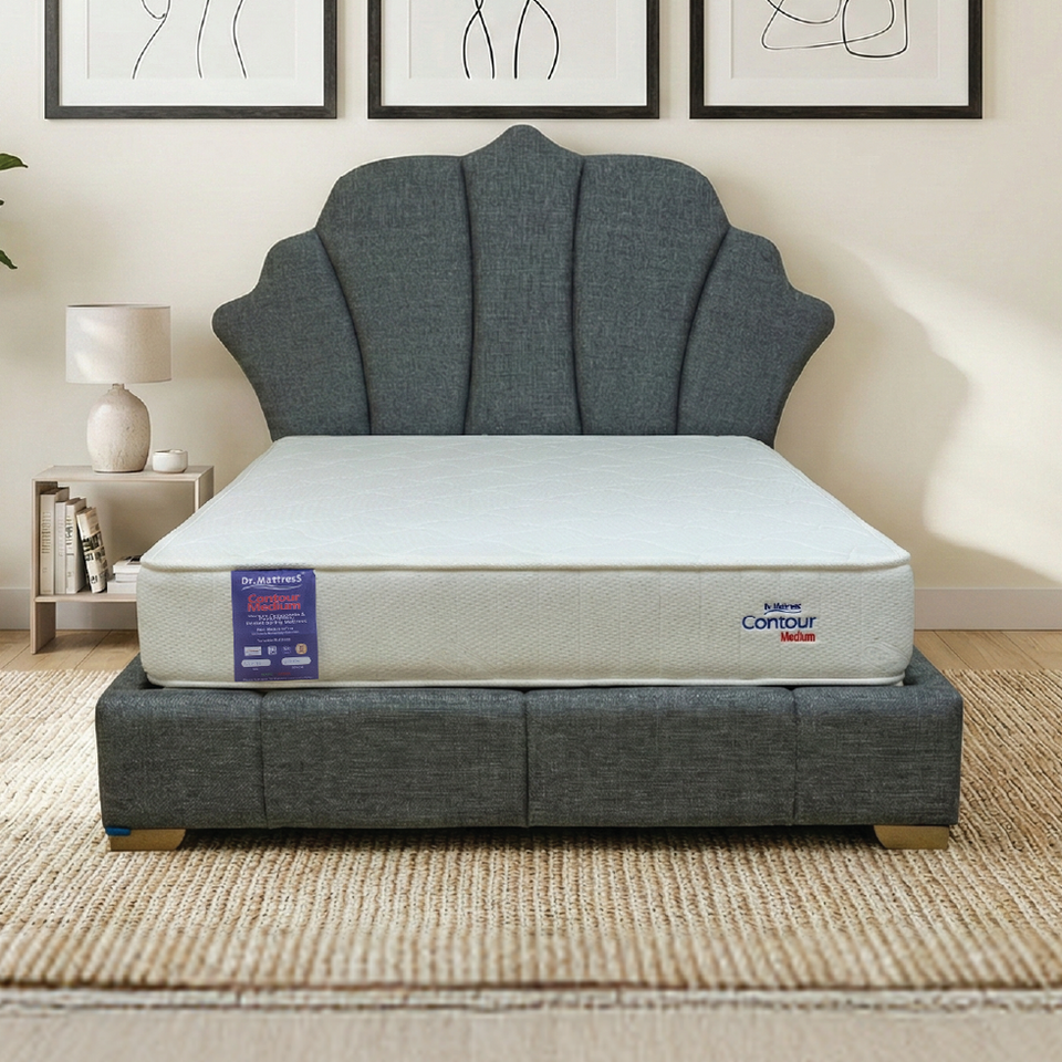 Full view of the grey TAJI Bedset, featuring a shell-shaped headboard and mattress.