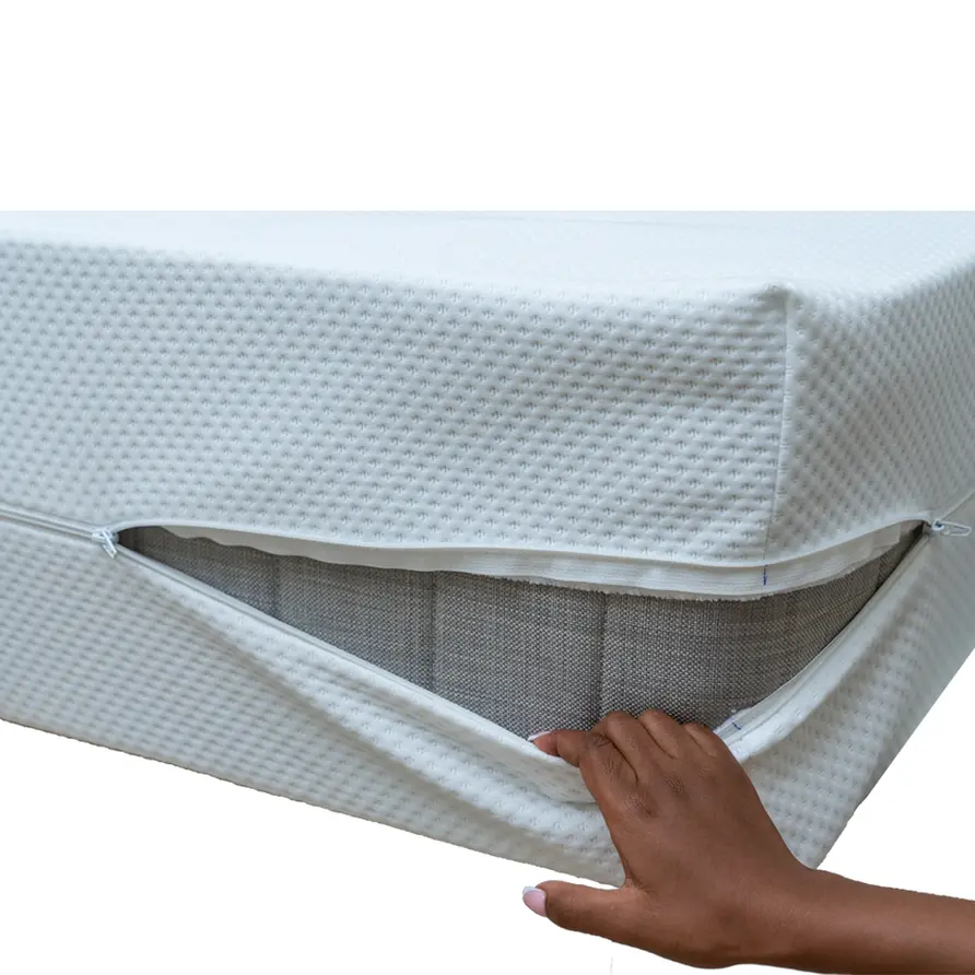 Hand lifting the unzipped edge of the Full Waterproof Mattress Protector with Zip (Encasement) to reveal the mattress inside.