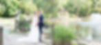 Bride and Groom on bridge over pond