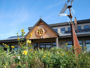 A building with solar panels on it. 