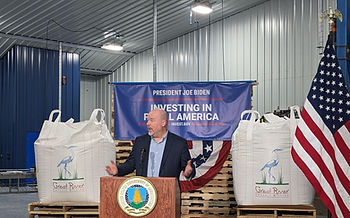 A man stands behind a podium.