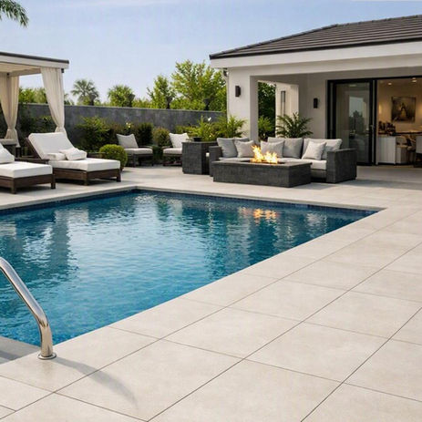 Outdoor patio tile deck surrounding swimming pool in Naples FL