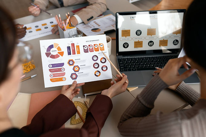 high angle view of people looking at digital marketing statistics