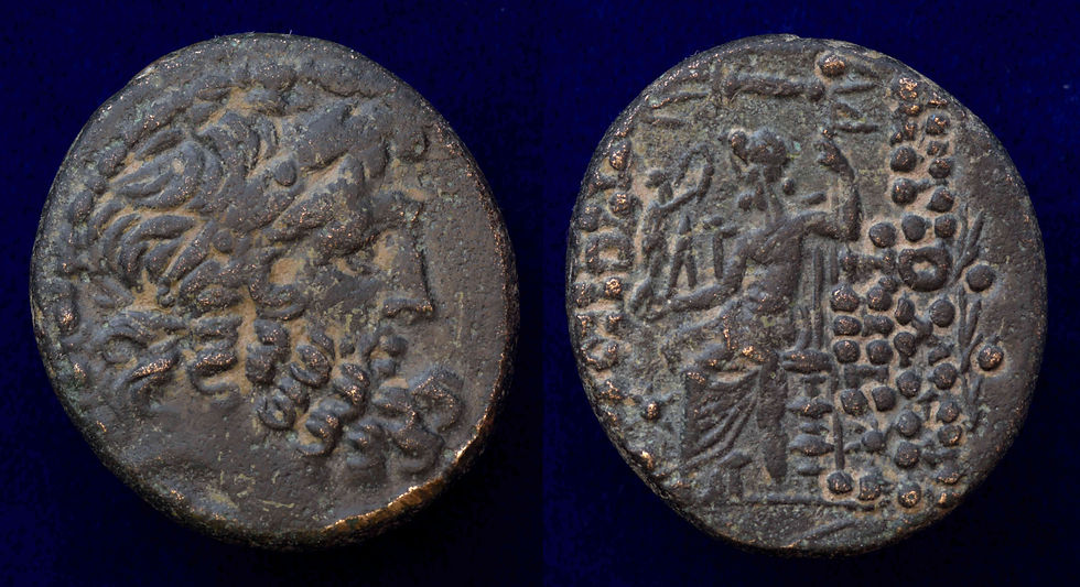 This coin does not have a Θ below that is visible - but appears to be a RPC 4225 minted by the Romans in 41/40 BCE. (Year 9 of the CAesarean Era) This coin has an obverse die match to this CNG Coin. Note the caps with storas - one on right is behind the throne.