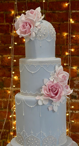 Pink and blue lacy wedding cake