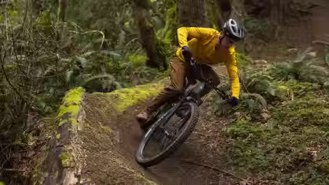 Mountain bike rider ridding purpose built mtb trails on Yeti mountain bike. 