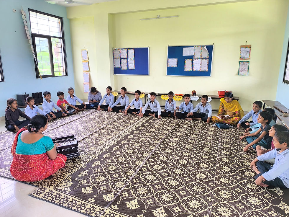 Children doing meditation in the classroom at Bodh