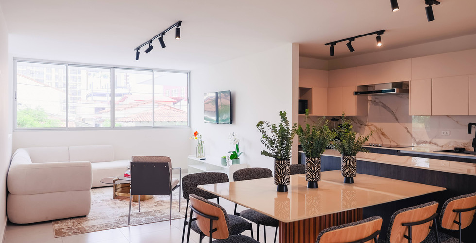 Modern open-plan apartment living, dining, and kitchen