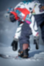 Person adjusting snowboard binding to ShredLORD