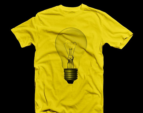Yellow Tshirt with a lightbulb printed on the front and black background