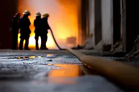 Firefighters in warehouse.webp