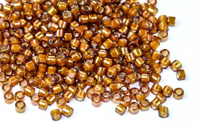 Thumbnail: DB1779 Miyuki Delica Beads White Lined Dark Topaz AB