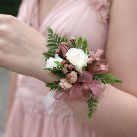 Dusty Pink Wrist Corsage on girl wrist 