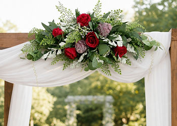 Burgundy rose and protea arbour arrangement