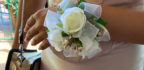 White rose wrist corsage for affordable wedding flowers.