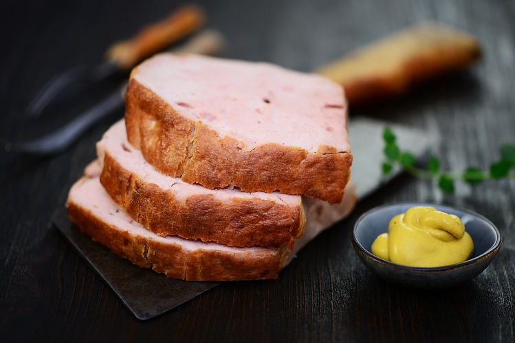 Three slices of meat loaf with mustard.jpg