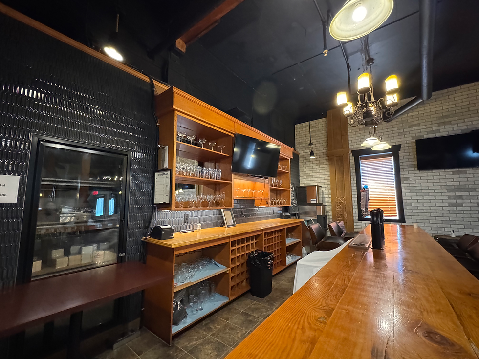 The Bar & Lounge: a long wooden bar with glassware shelves