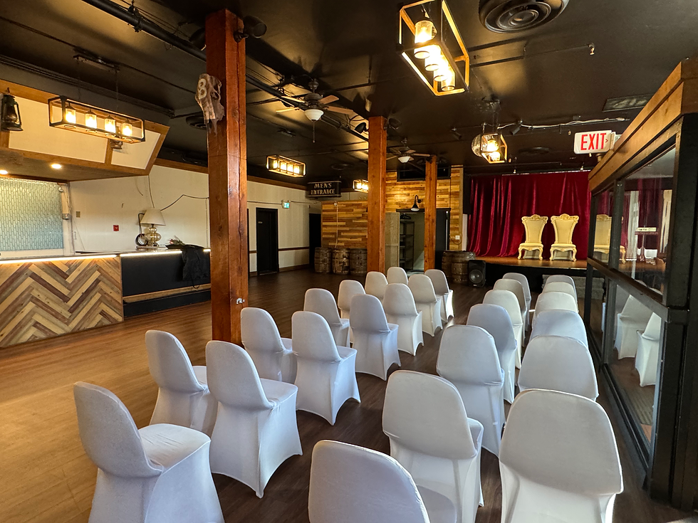 Rows of white chairs facing the stage in the Grand Hall