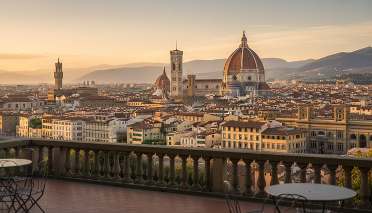 Wide-angle view of Florence Cathedral rising above terracotta rooftops.