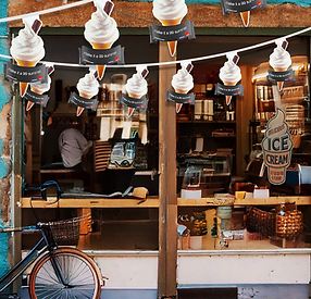 Custom printed bunting showing die cut ice creams hanging in front of an ice cream shop.png