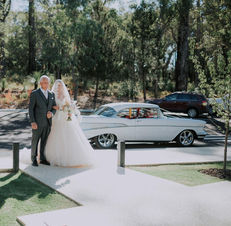 Belle Car Hire Lauren and her Dad start of steps colour Aravina March 22.jpeg
