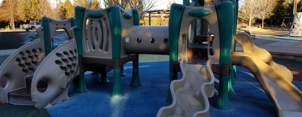 Larkspur park playground in Bend, Oregon todler playground equipment with slide and tunnel