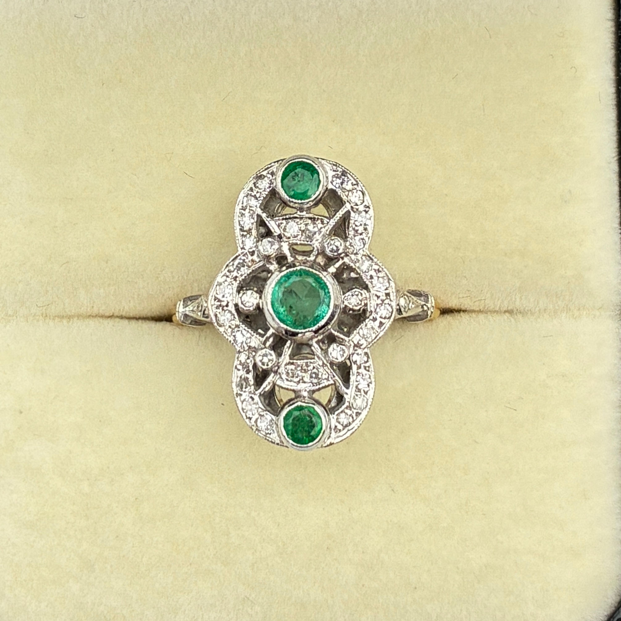 Emerald and moissanite ring
