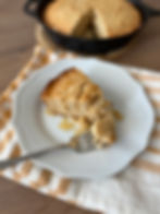 A slice of cake drizzled with honey.