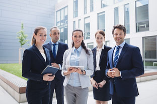 businesspeople-standing-outside-office-building.jpg