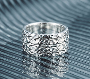 Venus Sterling silver textured band ring on acrylic